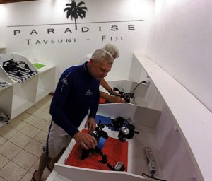 two divers doing their gear service in a Camera Room